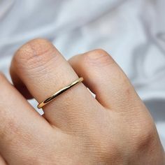 14K Solid Gold Women's Simple Wedding Band 🌟 Product Features: ⚖️ Weight: 1.65 Grams 🌈 Material Colors: Available in Yellow Gold, Rose Gold, and White Gold 🎁 Presentation: Shipped with a special box and bag, perfect for gifting 🔄 Returns: Right to return within 7 days ✨ Material and Color: Designed to never fade or darken 🛠️ Handcraftsmanship and Uniqueness: Handcrafted with love, may vary by 5% (+-) Celebrate your love with the timeless elegance of the 14K Solid Gold Women's Simple Wedding Simple Gold Wedding Band, Plain Gold Wedding Bands, Ring Simple Gold, Minimalist Wedding Band, Gold Ring Simple, Simple Wedding Band, Simple Wedding Bands, Plain Gold Ring, Godfather Gifts