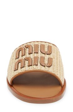 A topstitched leather logo appliqué details the wide, woven raffia band of this slide sandal that's ready for some fun in the sun. Textile and leather upper/leather lining/rubber sole Made in Italy Designer Shoes Woven Straw Open Toe Slides, Luxury Summer Slides With Rubber Sole, Designer Beach Slides With Branded Insole, Designer Slides With Branded Insole For Beach, Designer Open Toe Sandals With Woven Leather, Luxury Sandals With Leather Trim For Summer, Luxury Leather Trim Sandals For Summer, Designer Leather Slides For The Beach, Beige Beach Slides With Rubber Sole