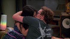 two people are hugging each other while on the set of tv show friends like us