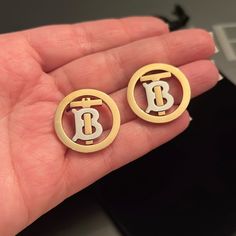 Burberry Gold Monogram Earrings Authentic Preloved In Good Condition- They Do Have Hair Line Scratches I Try To Capture At My Best Did Different Lighting Please See Pictures These Are Absolutely Stunning Will Come In Generic Dust Bag Feel Free To Ask Questions All Sales Are Final Burberry Jewelry, Monogram Earrings, Hair Line, Gold Monogram, Earrings Color, Silver Gold, Burberry, Dust Bag, Jewelry Earrings