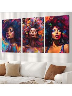 three paintings on the wall of a living room