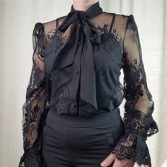 Black Lace Long Sleeve Top With Camisole A Semi-Sheer Lace Top Featuring A Tie Neck Collar, Bishop Sleeves With Elasticized Cuffs, Eyelash Lace Trim, And A Removable Camisole Lining. Shell: 100% Nylon Lining: 100% Polyester All Measurements Are Approximate Medium: 19.5" Pit To Pit, 24" Length Fitted Lace Top Blouse For Office, Black Non-stretch Tops For Work, Chic Black Lace Blouse, Chic Black Lace Tops, Black Lace Top For Workwear, Black Lace Top For Work, Elegant Black Stretch Tops, Casual Black Lace Blouse, Fitted Black Blouse For Office