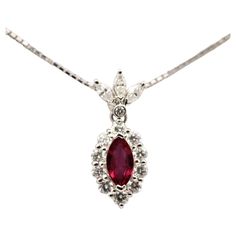 A 7.34 carat natural ruby is the centerpiece to this special pendant. Rubies are the hardest of the big 3 gemstones (ruby, sapphire, emerald). Accenting the center stone in halo setting are round brilliant cut diamonds. To add more glamour to the piece are three marquise cut and one round brilliant cut diamonds that are form to look like a crown. Total weight of the diamonds are 0.62 carats and are set in platinum. Platinum Necklace, Ruby Pendant, Halo Setting, Ruby Sapphire, Ruby Diamond, Marquise Cut, Natural Ruby, Round Brilliant Cut Diamond, Round Brilliant