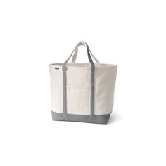 a white and grey tote bag on a white background with the handles folded down