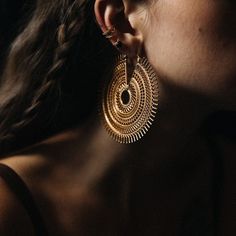 An exquisite fusion of heritage, these Afghan-inspired hoop earrings transcend craftsmanship with meticulous lacework adornments. More than accessories, they symbolize a revival of antiquity, capturing the profound beauty discovered along life's journey. Their essence exudes raw and fierce elegance, making a powerful statement in both style and substance. Design: by NOIR KĀLA Material: Brass Diameter: 8 cm Wire thickness: 18 Gauge Weight: 45 g (pair) Ear Weights, Electronic Gifts, Jewelry Inspo, Tops Designs, Jewelry Earrings, Hoop Earrings, Accessory Gift, 925 Sterling Silver, Electronic Accessories