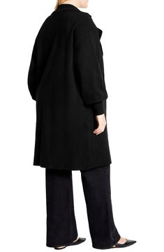 A versatile layering piece, this cozy longline cardigan keeps your look on trend with a notched collar and billowy balloon sleeves. 42 1/2" length Open front Notched collar Long sleeves Viscose/nylon/polyester Machine wash, dry flat Imported V-neck Outerwear For Daywear In Fall, Versatile Long Outerwear For Work, Versatile Open Front Winter Outerwear, Versatile Long Outerwear For Layering, Versatile Sweater Coat For Work, Oversized Sweater Coat For Daywear, Fall V-neck Sweater Coat For Work, Open Front Sweater Coat For Fall Daywear, Oversized Solid Sweater Coat For Layering