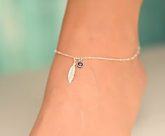 This anklet has a feather charm with an evil eye. The ankle bracelet is sterling silver 925. It is a dainty piece of jewelry that is great for the summer. The anklet has an extension so it can be adjusted to fit comfortably with different shoes. I can also customize the size for you, so feel free to message me if you need a custom order, or if you have any questions. Evil Eye Anklet Silver, Anklet Designs Beads, Evil Eye Jewelry Bracelet, Evil Eye Bracelet Silver, Ankle Bracelets Boho, Evil Eye Anklet, Silver Anklets Designs, Silver Bracelet Designs, Silver Bracelet For Women