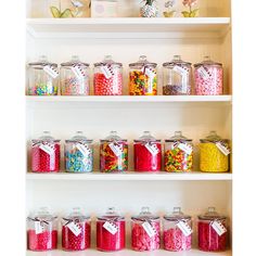 the shelves are filled with many different types of candy