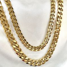 DESCRIPTION: A statement classic, our 18K Gold Plated Cuban Chain is perfect on its own or layered with our pendant necklaces. Diamond cut links allows it to shine from all angles making this the must have chain for everyone. Matching 18K Gold Cuban Bracelet available. MATERIAL: 18K Gold Plated over Stainless Steel. Hypoallergenic, Tarnish Free and Water Resistant. MEASUREMENTS: Width: 7mm or 9mm Mix and match with any of our 18K Gold Necklaces and Anklets to create the most unique and customize Luxury Gold Plated Cuban Link Necklace In Yellow Gold, Heart Initial Necklace, Gold Cuban Chain, Customized Necklace, Necklaces Diamond, Gift For Him Birthday, Cuban Bracelet, Heart Necklaces, 18k Gold Necklace