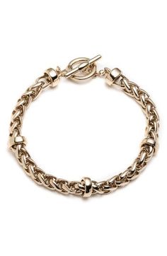 This simple yet sophisticated chain-link bracelet is secured by a toggle closure. 7 3/4" length Goldtone plate Imported Ralph Lauren Bracelet, Ralph Lauren Jewelry, Stone Bangle, Toggle Bracelet, Designer Fashion Jewelry, Collar Jewelry, Hinged Bangle, Pearl Stud Earrings, Zen Garden