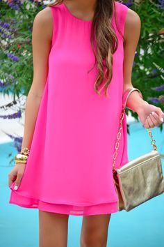 This dress rocks a flattering A-line shape in a summer-worthy color! The solid color makes it so easy to mix up your accessories to your heart's content. Dress is lined and has a button keyhole detail in the back. Summer Beach Dress With Keyhole Back, Pink Solid Color Mini Dress For Summer, Summer Dresses With Keyhole Back For Day Out, Sleeveless Summer Dress With Keyhole Back, Dressy A-line Mini Dress For Summer, Summer Day Out Dress With Keyhole Back, Pink Solid Color Mini Dress For Vacation, Summer Mini Dress With Keyhole Back For Date Night, Chic Vacation Dress With Keyhole Back