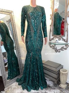 The Emmy gown is a emerald green sequins gown in a size S/M with some stretch. Bust 31”-38”, Waist 30”-38”, hips 37”-44”. L/sleeve 22”. Shoulder to knee 33”. L/train front 30”, back 38”. Fitted Contrast Sequin Gown For Prom, Glamorous Fitted Gown With Contrast Sequin, Fitted Green Sequin Evening Dress, Fitted Floor-length Evening Dress With Contrast Sequin, Green Long Sleeve Prom Gown, Fitted Green Evening Dress For Prom, Fitted Contrast Sequin Maxi Dress For Prom, Green Fitted Sequin Gown, Fitted Floor-length Gown With Contrast Sequin