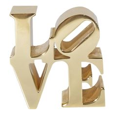 the word love spelled in gold metal letters