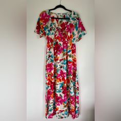 Reposh! This Bright Floral Patterned Dress Is Lightweight And Airy. It’s Short Sleeved With A Deep V-Neck And A Cinched Waist. It Comes With A Tie Belt To Add Some Flair. There Are Mid-Length Slits On Either Side. Reposhing Because It’s A Little Too Long For Me At 5’4”. Brand New With Tags, Never Worn. Short Sleeve Floral Print Midi Dress For Day Out, Tropical Print V-neck Maxi Dress For Brunch, Casual Multicolor Tropical Print Midi Dress, Casual Multicolor Midi Dress With Tropical Print, Pink V-neck Rayon Dress, Multicolor Short Sleeve Floral Dress For Summer, Multicolor Short Sleeve Midi Dress For Garden Party, V-neck Tropical Print Maxi Dress For Garden Party, Printed Short Sleeve Midi Dress For Spring