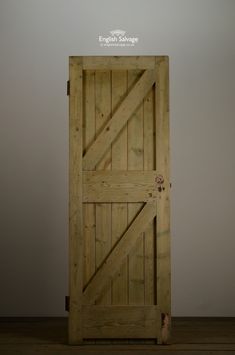 an open wooden door with the words english salvage on it