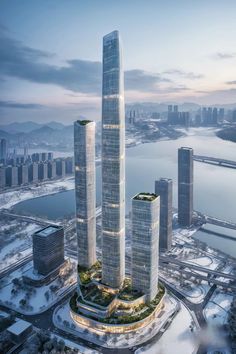 an aerial view of two skyscrapers in the middle of a large body of water