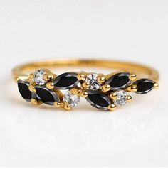 This is Christian Buschi. I am a specialist in making jewelry in artistic designs. If you want me to prepare rings set of your thoughts, share your vision and I'll shape that vision to reality. SKU Number - N/A Material - 14K/18K Solid Gold Gemstone - AAA Natural Black Onyx Gemstone Gemstone Shape - Marquise Gemstone Size - 5x2.50mm Gemstone Weight - 0.14ct Natural white Moissanite accents Metal Weight- 3.90cts Approximate Metal stamp - 14K /18K Occasions - Engagement , wedding , birthday , anniversary etc. Elegant Black Marquise Cut Diamond Ring, Black Cubic Zirconia Gemstone Rings, Gift Black Sapphire Ring With Black Diamonds, Black Sapphire Ring With Black Diamonds As Gift, Elegant Black Cluster Ring For Promise, Black Cluster Ring In Fine Jewelry Style, Black Cubic Zirconia Rings For Anniversary, Black Cubic Zirconia Rings For Gift, Black Cubic Zirconia Rings As Gift