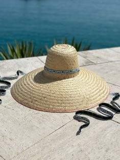 In collaboration with The Rosewood Bermuda, our wide-brimmed Geranium sun hat is woven with a vintage ribbon sourced with Bermuda's iconic cedar tree (scientific name Juniperus Bermudiana) in mind. From each sale of this sun hat, 20% will be donated to The Rosewood Bermuda's Juniper Initiative (which, in partnership with the Bermuda National Trust, plants cedar trees around the island). The Bermuda Cedar tree is the most notable tree in the mid Atlantic. However, the endemic evergreen, that orig Palm Tree Leaves, Cedar Trees, National Trust, Vintage Ribbon, Wide Brimmed, Natural Texture, Geraniums, Sun Hats, Ribbon