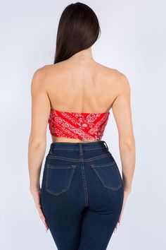 the back of a woman wearing jeans and a red top