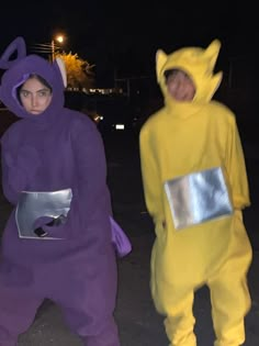 two people in costumes standing next to each other