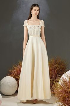 Cream A-line Evening Dress For Party, Organza A-line Gown For Prom, Evening A-line Organza Gown, A-line Organza Gown For Prom Season, A-line Organza Gown For Prom, Elegant A-line Gown With Boned Bodice, Organza Dresses With Sweep Train For Banquet, Elegant White A-line Ball Gown, Sweetheart Neckline Organza Gown For Banquet