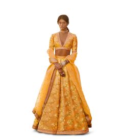 A perfect definition of superb craftsmanship in this beautiful Yellow colored designer sabyasachi bridal lehenga choli.
Beautified with amazing heavy embroidery with zari,dori & sequence work within the attire adds a sign of elegance statement with your look.
The semi-stitched lehenga is made of Thai Silk fabric accompanied with unstitched embroidered matching fabric blouse piece and embroidered Thai Silk dupatta.
Suitable to wear for wedding functions, engagement ceremony and special occasi Elegant Yellow Chanderi Choli, Yellow Raw Silk Dress With Intricate Embroidery, Elegant Yellow Silk Choli, Fitted Yellow Art Silk Embroidered Fabric, Fitted Yellow Embroidered Art Silk Fabric, Yellow Raw Silk Choli With Dupatta, Silk Lehenga With Gold Embroidery In Traditional Drape, Yellow Silk Lehenga With Intricate Embroidery, Yellow Silk Anarkali Set With Resham Embroidery