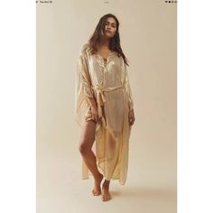 Free People Shilow Kaftan In Gold Small. Style No. 68921360; Color Code: 070 Sparkle And Shine With This Glimmering Kaftan By Sundress, Featured In A Relaxed, Pull-Over Silhouette With Flared Bell Sleeves, Belted Waistband, And Sheer Metallic Fabrication For A Head-Turning Finish. Pull-Over Style Bell Sleeves Maxi Length Robe Tie Detail What’s Care Fp? This Product Was Consciously Made To Reduce Our Footprint And Supports Our Mission To Be A Little Bit Better Every Day. Specifically, This Produc Gold Maxi Dress For Summer Beach, Gold Kaftan For Summer Vacation, Long Gold Maxi Dress For Summer, Gold Bohemian Kaftan For The Beach, Gold Maxi Beach Dress, Gold Maxi Dress For The Beach, Gold Maxi Length Dress For Beach, Gold Bohemian Maxi Dress For The Beach, Gold Bohemian Maxi Dress For Beach