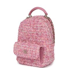 This Chanel mini phone holder backpack with chain is in pink multicolored tweed with light gold hardware, features a backpack style bag, small front snap coin pocket with CC logo, pink leather top handle, zip around closure with leather pull and CC logo charm, convertible light gold tone chain interwoven with light pink leather crossbody/shoulder strap.The interior is lined in pink grossgrain fabric with two interior card slots.Collection: 24POrigin: ItalyCondition: New and never worn (plastic on hardware)Accompanied by: Chanel box, Chanel dustbag, retail UPC, ribbon and carebookMeasurements: 5" width x 7" height x 2.5" depth; 21.5" strap drop; 1" top handle Pink Chanel Backpack, Mini Chanel Bag, Mochila Chanel, Mini Phone, Chanel Box, Chanel Pink, Chanel Backpack, Logo Pink, Pink Tweed