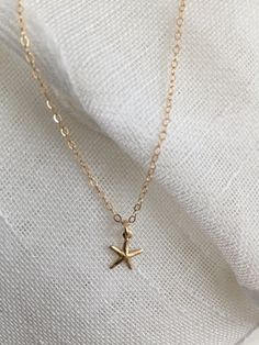 "♡ 14K gold-filled 18\" chain with 4/8\" hallow starfish charm- all components used on this necklace is 14k gold filled, sourced from USA. ♡ If your purchase is a gift, let me know and I'd be happy to include a lovely gift card for no additional charge. All items are packaged in jewelry boxes. ♡ Most of my jewelry can be ordered in multiples. Please contact me if you are interested in purchasing two or more of one item and I can set up a special listing for you. ♡ All orders ship to the address Gold Starfish Charm Necklace, Yellow Gold Starfish Necklace As Gift, Dainty Gold Starfish Charm Necklace, Gold Charm Necklace With Starfish Charm, 14k Gold Starfish Charm Jewelry For Gifts, Gold Jewelry With Starfish Charm For Gift, Gold Jewelry With Starfish Charm As A Gift, 14k Gold Jewelry With Starfish Charm For Gift, 14k Yellow Gold Starfish Jewelry