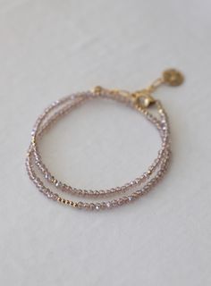 Petite Champagne Double Wrap Bracelet with Gold Accents - Small champagne crystal beads with gold accents and tassel . - Can be worn as a single layer choker necklace - Measures an adjustable 13.5-14.5 Dainty Crystal Bracelet, Double Strand Bracelet, Beads Bracelet Ideas, Gold Beads Bracelet, Double Bracelet, Layered Choker Necklace, Metalsmithing Jewelry, Double Wrap Bracelet, Layered Chokers