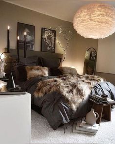 a bedroom with a large bed covered in fur