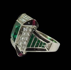 Luxury Multi-stone Emerald Platinum Ring, Fine Jewelry Platinum Emerald Ring With Polished Finish, Platinum Emerald Ring With Polished Finish, Luxury Multi-stone Emerald Cut Emerald Ring, Green Baguette-cut Platinum Jewelry, Exquisite Green Emerald Platinum Ring, Green Octagon Platinum Ring, Octagon Emerald Ring In Platinum, Luxury Green Emerald Ring With Diamond Cut