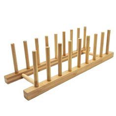 a wooden rack with several pegs in it