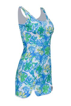 Keep your style fresh, fun, and floral for the summer with this brightly printed Lilly Pulitzer dress! This piece is designed with a bodycon silhouette and mini cut to create a spunky feel that matches the vibrant print featuring flowers and fruit. Slip into this cheery little mini for some fun in the sun along with sandals and your favorite pair of sunnies! Size XXS 100% Polyester Fully lined Pullover Bodycon silhouette Scoop neckline Sleeveless Bust 30" Waist 24" Shoulder to hem 31" Summer Bodycon Printed Mini Dress, Blue Printed Swim Dress, Summer Fitted Printed Swim Dress, Fitted Printed Swim Dress For Summer, Blue Printed Swim Dress For Poolside, Casual Blue Swim Dress For Summer, Fitted Printed Summer Swim Dress, Fitted Summer Swim Dress With Floral Print, Fitted Printed Mini Dress For Beachwear