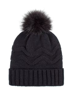 a black hat with a fur pom