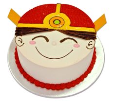 a birthday cake with a smiling face on it