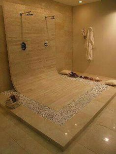 a bathroom with a large walk in shower