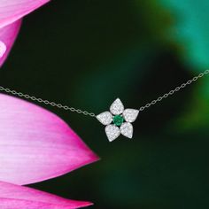 Magical diamond and emerald flower necklace by jewelry designer ASCHERON. I have been looking at this flower all summer long as it has grown right up to my window and I always thought how much I would love to make it. Metals - Available in 18K white or yellow gold. Gemstone - Natural emerald gemstone measuring 4mm round. 0.25ct in weight. Diamonds - 0.45ct of GVS excellent white quality diamonds. Ethically sourced. Flower - measures 15mm across. Chain - measures 18 inches long. Shipping - Ships Flower-shaped Diamond Necklace For Anniversary, Flower Shaped Diamond Necklace For Anniversary, Elegant May Birthstone Necklace In Flower Shape, Elegant May Birthstone Necklace With Flower Shape, Elegant Flower Shaped Necklace With May Birthstone, Elegant Flower-shaped Necklace With May Birthstone, Elegant Flower-shaped May Birthstone Necklace, Green Flower Pendant Necklace For Anniversary, Green Emerald Jewelry In Flower Shape