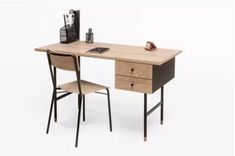 a wooden desk with two chairs and a computer on it, against a white background