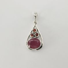 This is a beautiful red Ruby Pendant in 925 Sterling Silver. The metal is solid silver without any nickel or other substances causing most allergies making the jewelry hypo allergenic. Size of the Pendant (in total incl. Bail)   3.3 x 1.5 cm or 1.30 x 0.59 inch Please note: Our jewelry is photographed close up to show detail and may appear larger than they are. We are happy to help with any questions. You will receive the item in a gift box - perfect to surprise someone or yourself. Usually we s Fine Jewelry Ruby Teardrop, Ruby Teardrop Fine Jewelry, Red Sterling Silver Jewelry With Birthstone, Red Sterling Silver Jewelry With Polished Finish, Sterling Silver Jewelry With Red Birthstone, Red Drop Gemstone Jewelry, Red Gemstone Drop Jewelry, Teardrop Ruby White Gold Jewelry, Teardrop Ruby Jewelry In White Gold