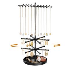 a jewelry tree with several necklaces hanging from it's sides and an arrow pointing to the top