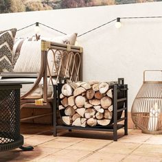 the firewood is stacked on top of each other in front of some chairs and lamps