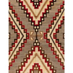 an old navajo rug with red, brown and white designs on the bottom half of it