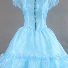 a light blue dress with ruffles on the skirt and collared neckline