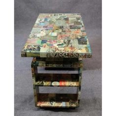 a multicolored table with three shelves on each side and one shelf holding magazines