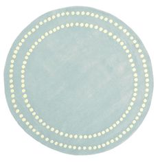 a round rug with white dots on it in light blue and yellow colors, isolated against a white background