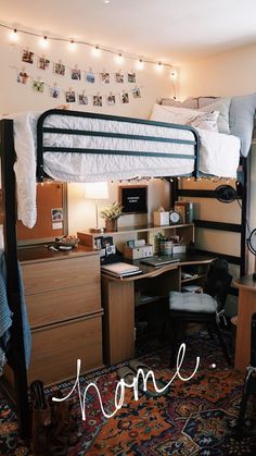 a dorm room with bunk beds, desk and computer on top of the bed is decorated with lights