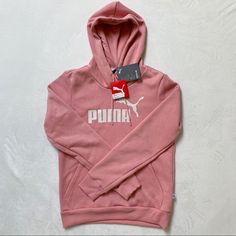 Puma | Ladies Size Small Nwt Pink Drawstring Hoodie With White Puma Logo On Chest. Soft And Fuzzy Interior Lining. Casual Puma Logo Sweatshirt For Winter, Sporty Puma Logo Sweatshirt For Winter, Winter Sporty Puma Logo Sweatshirt, Winter Puma Logo Hooded Hoodie, Winter Hoodie With Puma Logo, Puma Logo Sports Hoodie, Puma Hooded Hoodie For Sports, Puma Hooded Sports Hoodie, Casual Puma Logo Long Sleeve Hoodie