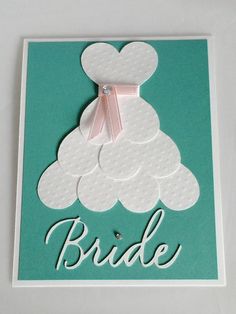 the bride card is made from white paper and has a pink bow on it's head