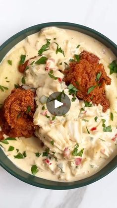 a bowl filled with mashed potatoes and meatballs